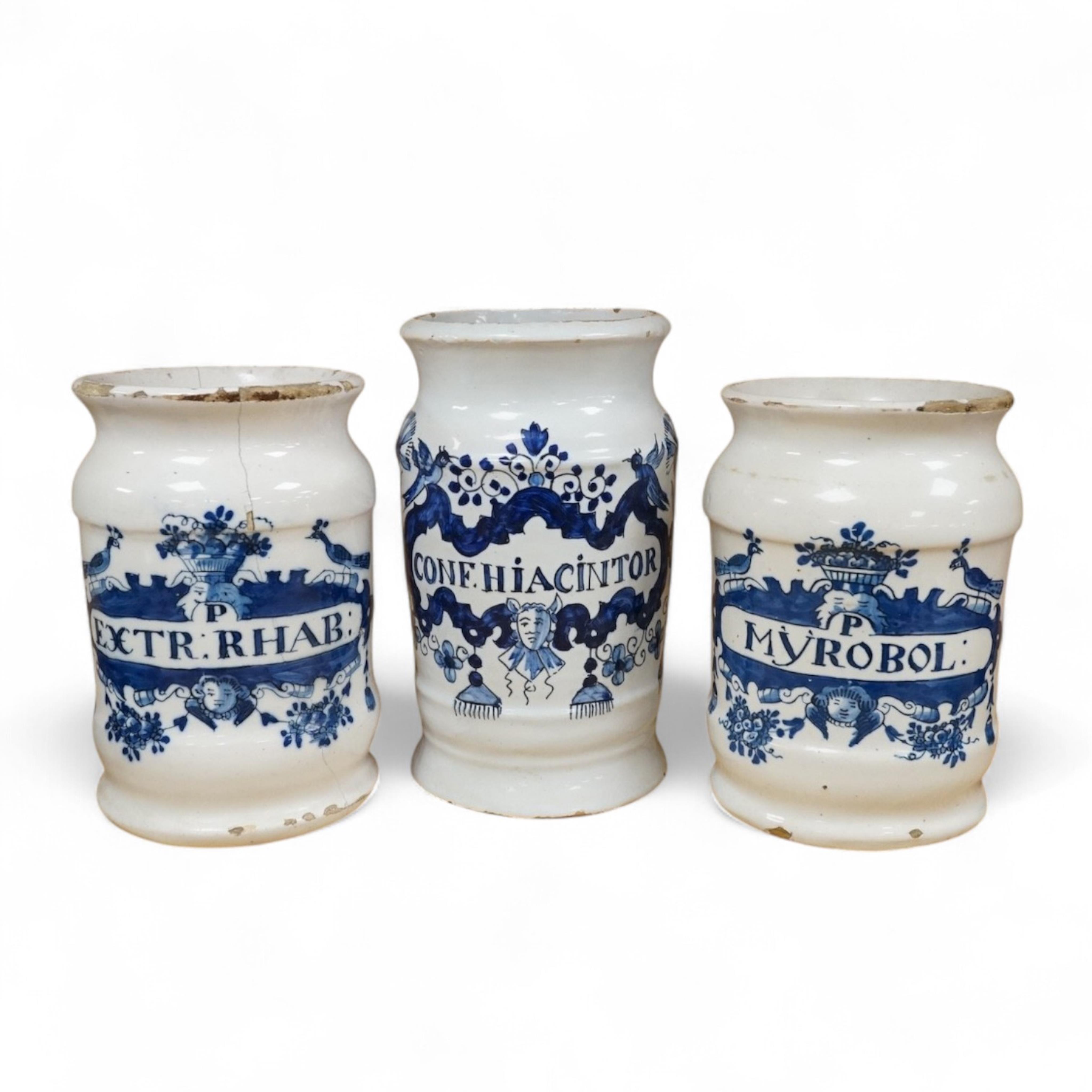 Three 18th century Delft blue and white drug jars; extract of rhubarb, Myrobol, and Conf. Hiacintor, largest 14cm high